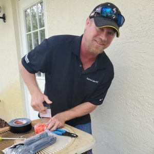 Owner Brian Lucas Working Repairing an AC unit